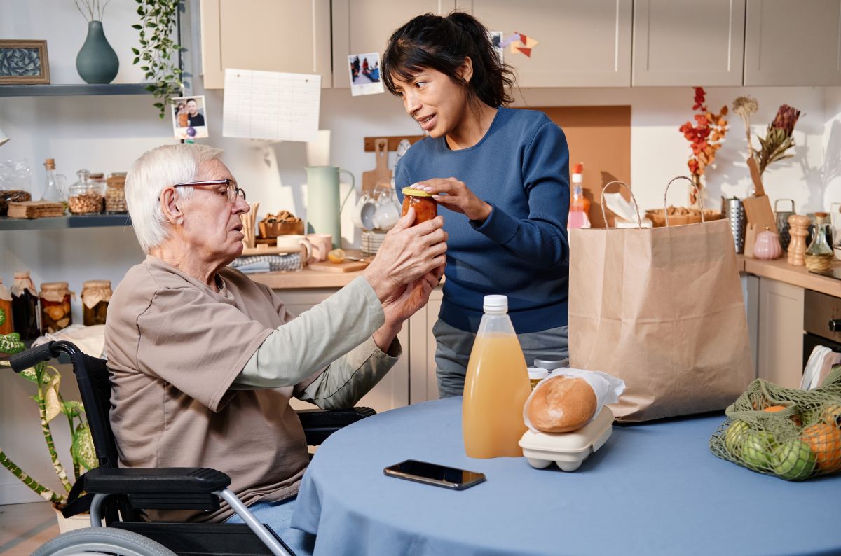 woman helping man with groceries